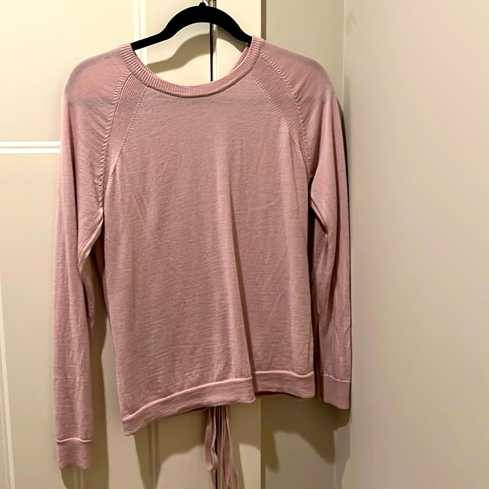 Women’s Lululemon sweater with tie up back. Soft pink color size 8.
